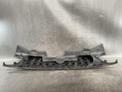 Front bumper lower grille support piece with multiple circular mounting holes, used in car front-end assembly