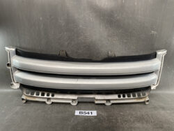 Automotive front grille assembly with three horizontal gray slats and mounting brackets, labeled B541.