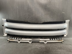 Front car grille assembly with surrounding bumper, likely a replacement part for a vehicle's front end