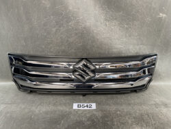 Chrome front grille of a Suzuki vehicle with the S emblem centered