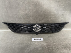 Black honeycomb front grille with a Suzuki emblem centered on a vehicle surface.