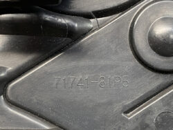 Close-up of a black plastic automotive component with an embossed part number: 71741-81P5.