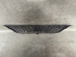 Black honeycomb-style car front grille with a central mounting area and hook at the bottom edge.