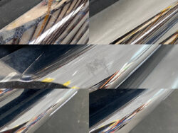 Close-up of a chrome car bumper with multiple surface scratches and scuffs across the polished metal surface.