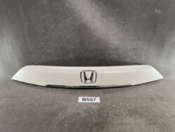 White car trunk trim with chrome Honda emblem in center