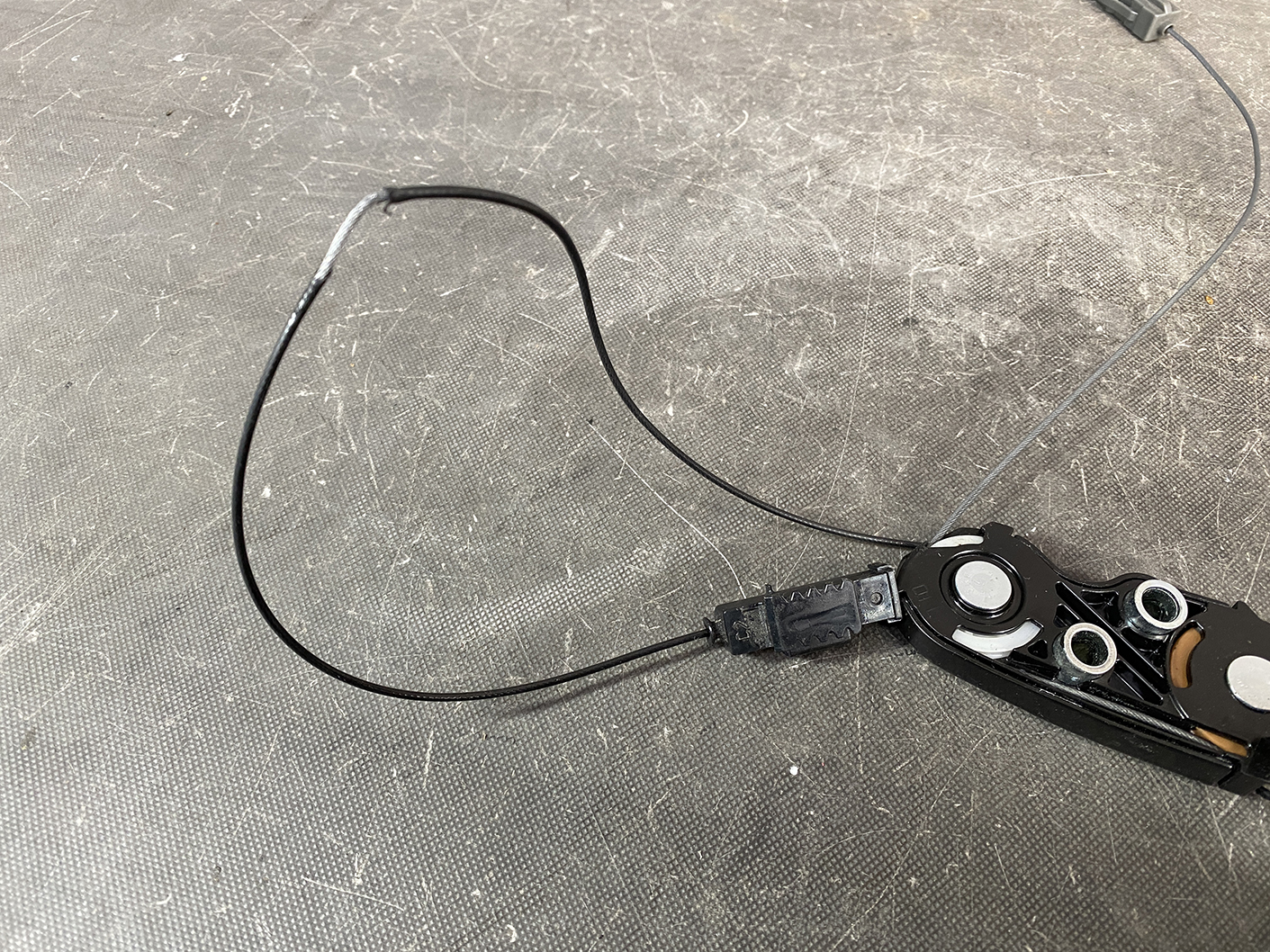 Suzuki Solio Mitsubishi Delica D:2 Genuine Power Slide Door Motor 79R0L Left Side 10 Partially disassembled wearable device with circular contact pads and USB cable on a scratched work surface.