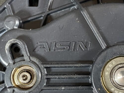 Suzuki Solio Mitsubishi Delica D:2 Genuine Power Slide Door Motor 79R0L Left Side 12 Close-up of a black plastic mechanical housing with the embossed brand 'ASIN' and two metal bearings on either side.