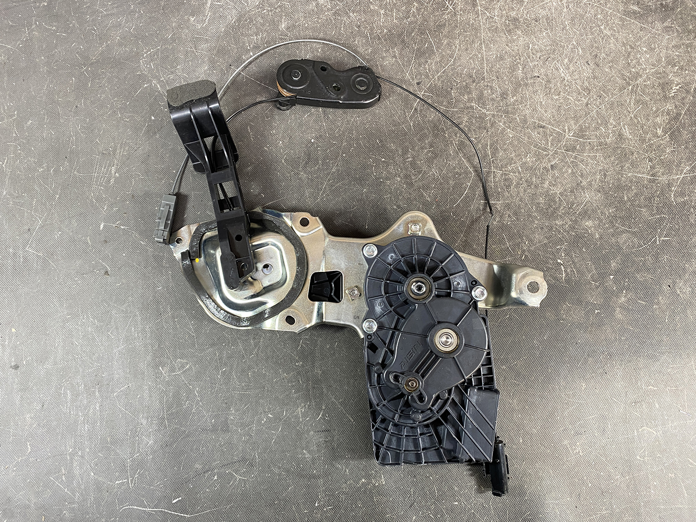 Suzuki Solio Mitsubishi Delica D:2 Genuine Power Slide Door Motor 79R0L Left Side 7 Automotive power window regulator and motor assembly with wiring harness on a workshop surface