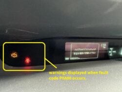 Dashboard with two warning lights: an orange engine/check‑engine light and a red alert/lock icon, referencing POA80 fault code.